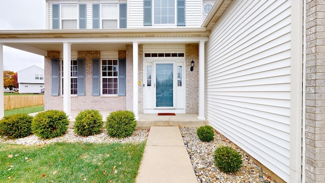 property entrance with covered porch