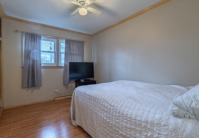 bedroom with ceiling fan, light hardwood / wood-style flooring, and crown molding