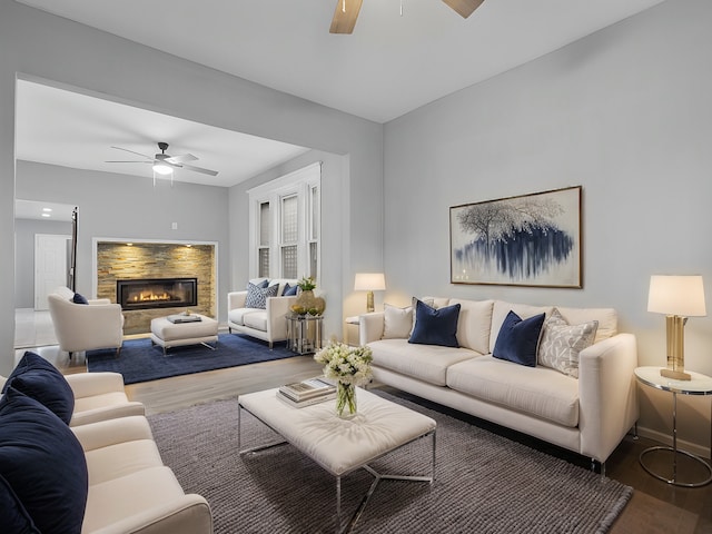 living room featuring hardwood / wood-style floors and ceiling fan