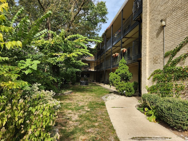 view of yard with a balcony