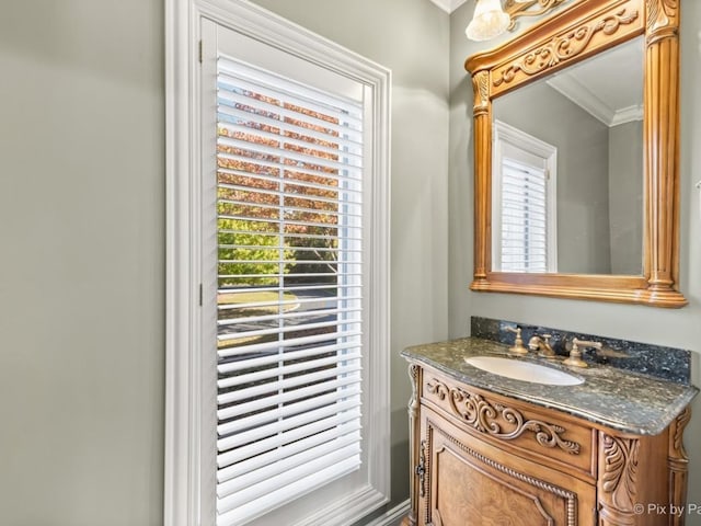 bathroom featuring vanity and crown molding