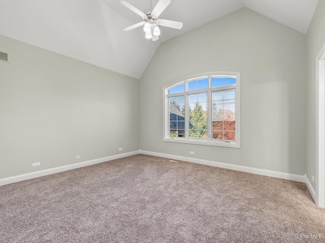 unfurnished room with vaulted ceiling and carpet flooring