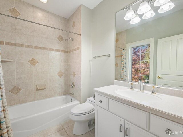 239 Indian Trail Rd, North Barrington, IL 60010 - full bath with tile patterned floors, toilet, shower / bathtub combination with curtain, vanity, and a chandelier