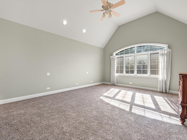 carpeted empty room with lofted ceiling and ceiling fan