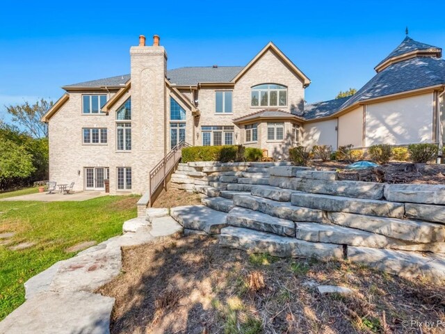 rear view of house featuring a patio