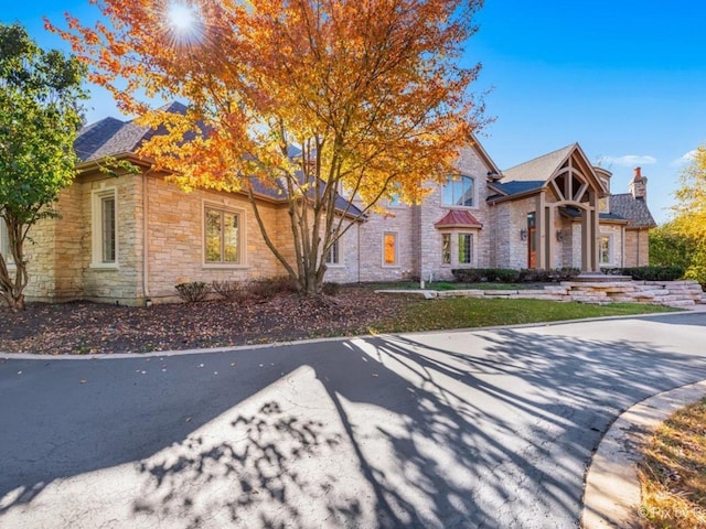 239 Indian Trail Rd, North Barrington, IL 60010 - view of front of property featuring stone siding and a chimney