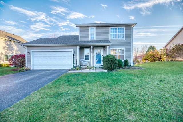 front of property featuring a garage and a front lawn