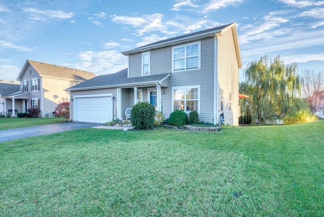 view of front facade featuring a front yard and a garage