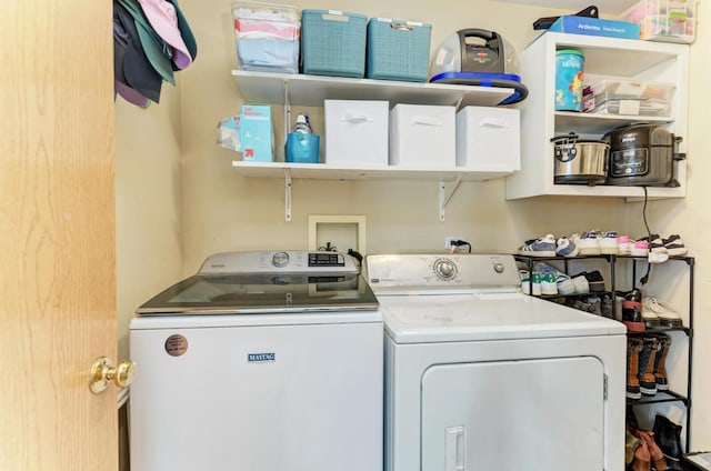 washroom featuring washing machine and dryer