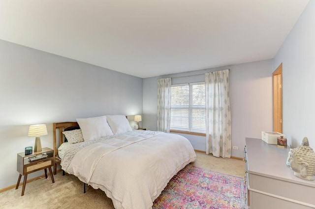 bedroom with light carpet