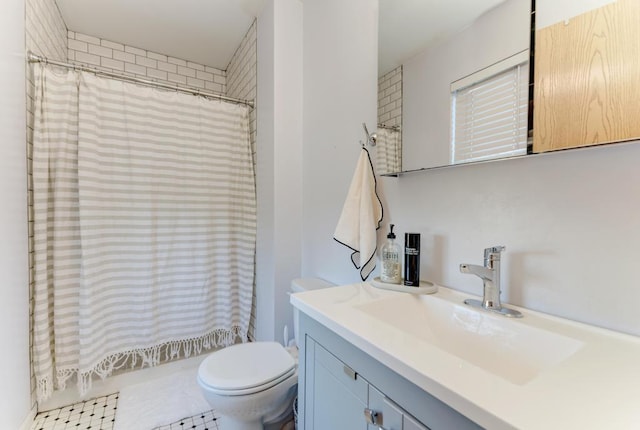 bathroom with toilet, walk in shower, vanity, and tile patterned floors