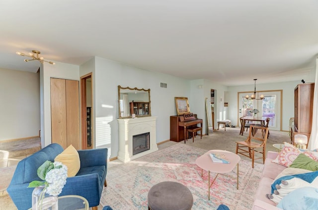 living room with light carpet and a notable chandelier