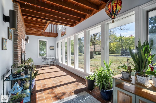 sunroom / solarium with beam ceiling, french doors, high vaulted ceiling, and wooden ceiling