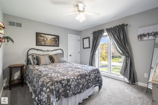 bedroom featuring a ceiling fan, visible vents, carpet, and baseboards