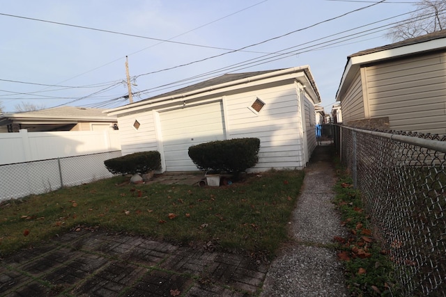 garage featuring a yard