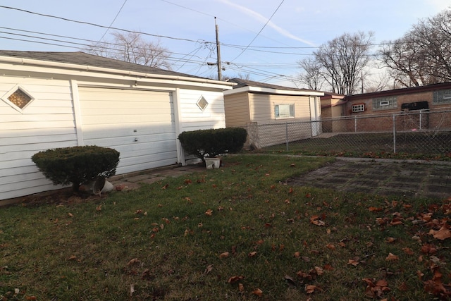 garage featuring a lawn