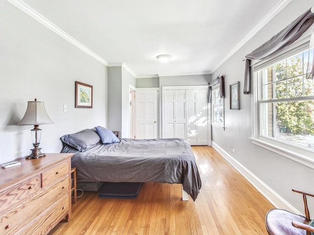 bedroom with ornamental molding and light wood-type flooring