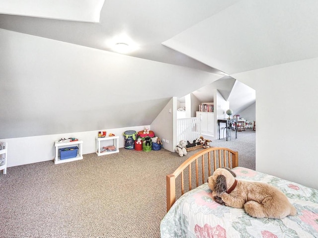 carpeted bedroom with lofted ceiling with skylight