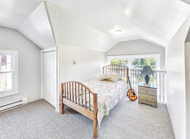 carpeted bedroom featuring multiple windows, a closet, a baseboard radiator, and vaulted ceiling