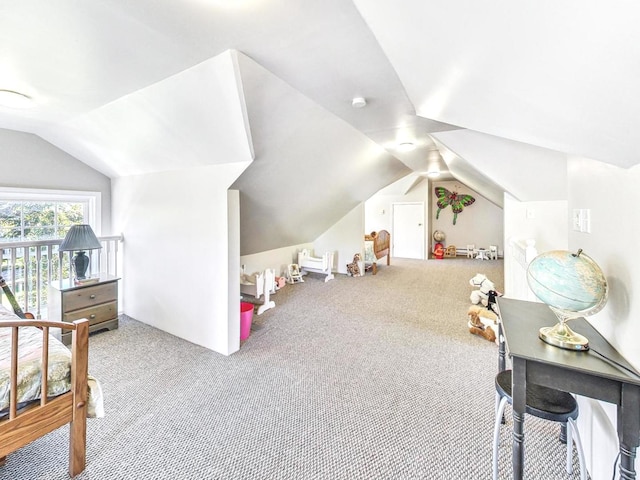 interior space featuring vaulted ceiling and light carpet