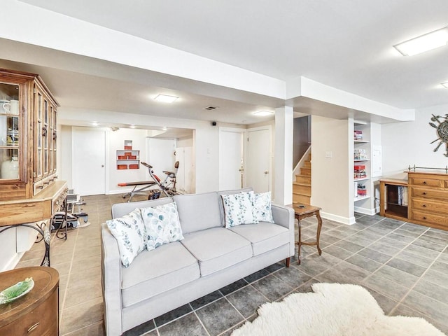 living room featuring dark tile patterned floors