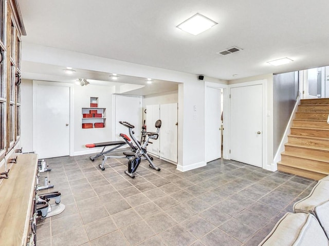 workout room with light tile patterned floors