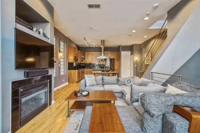 living room with light hardwood / wood-style floors