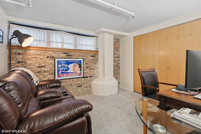 living room featuring light carpet and brick wall