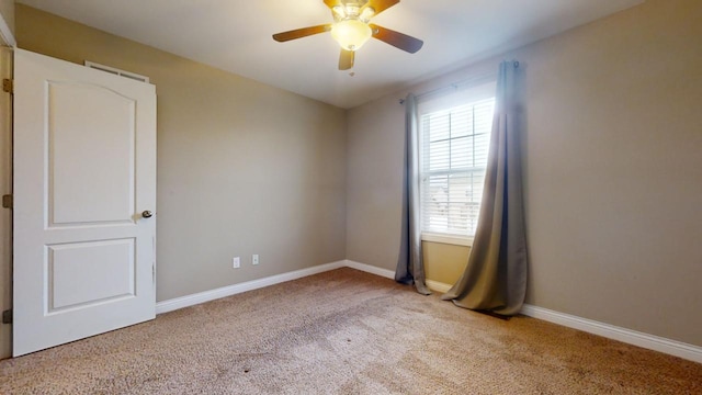 carpeted empty room with ceiling fan