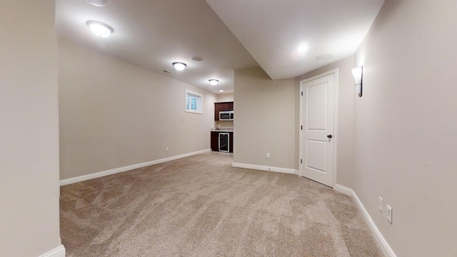 basement featuring light carpet