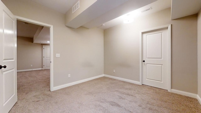 unfurnished room with light colored carpet