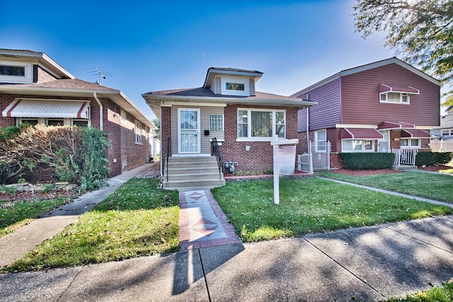 bungalow with a front lawn