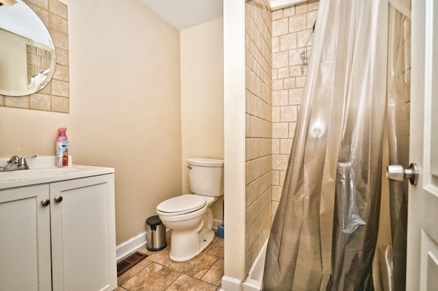 bathroom with toilet, walk in shower, vanity, and tile patterned floors