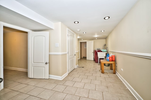 hall featuring light tile patterned floors