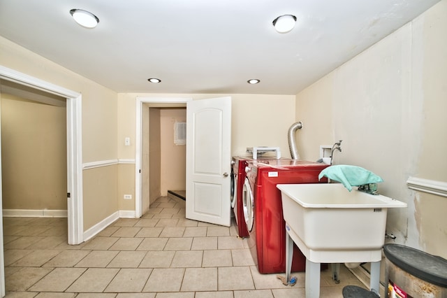 washroom with washing machine and dryer and light tile patterned floors