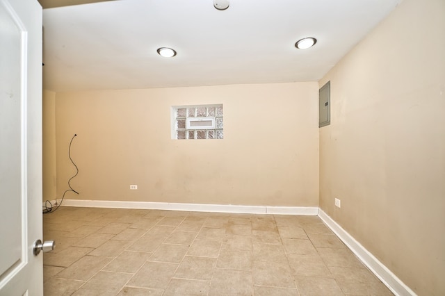 interior space featuring light tile patterned flooring and electric panel