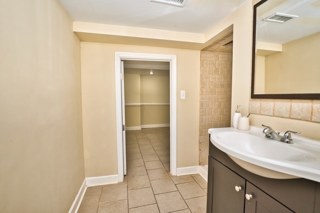 bathroom with vanity and tile patterned flooring