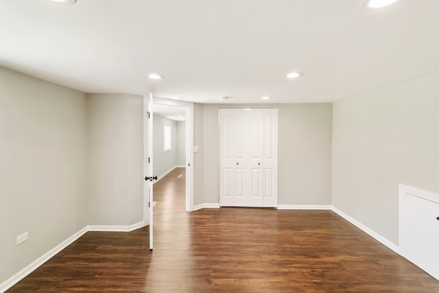 unfurnished room featuring dark hardwood / wood-style flooring