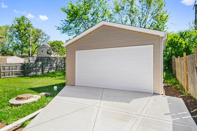 garage featuring a lawn