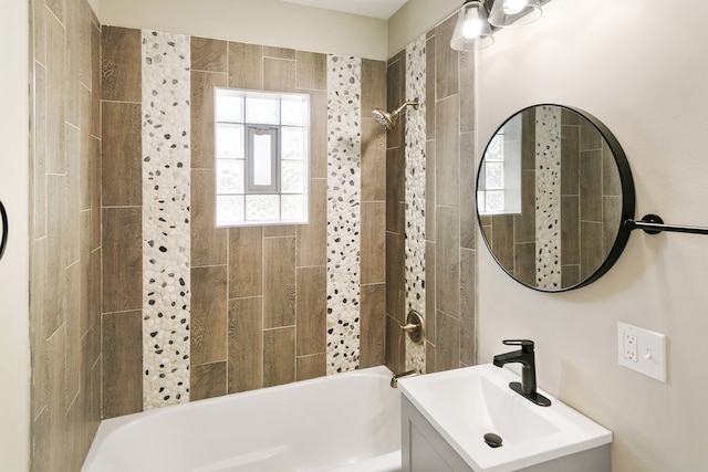 bathroom with vanity and tiled shower / bath combo