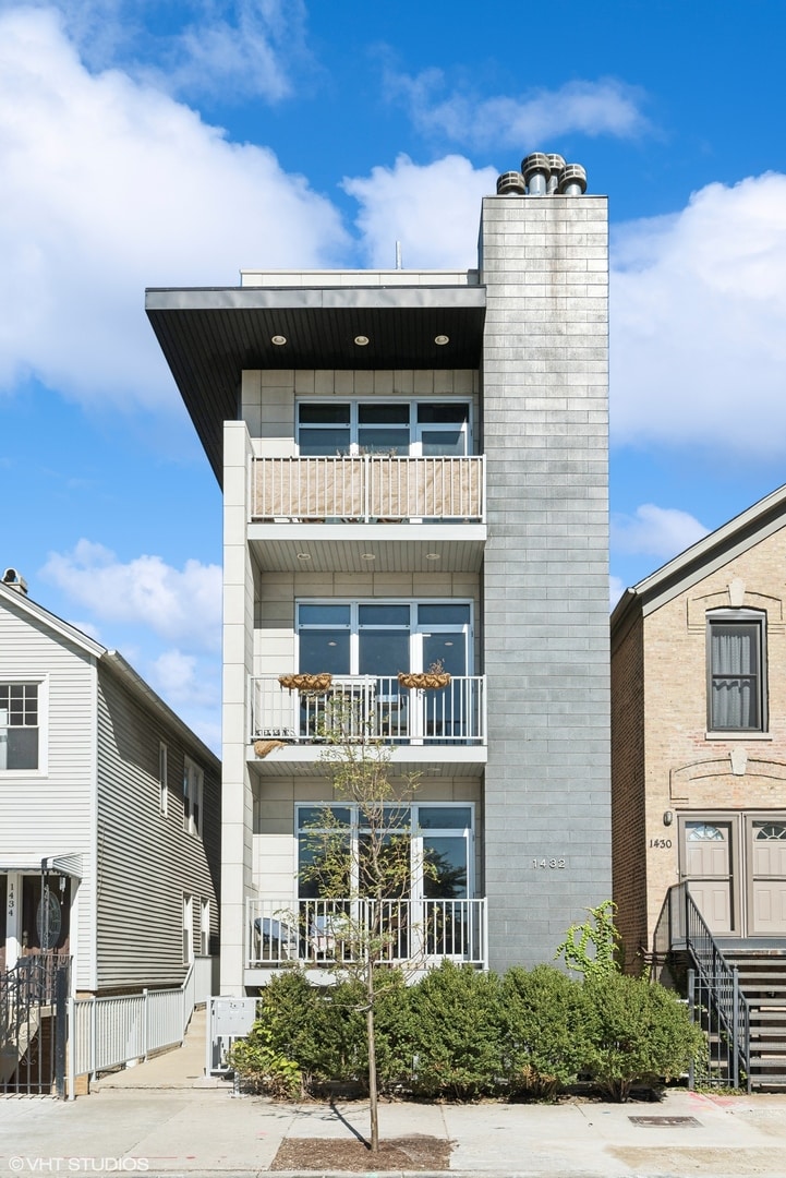 view of front of house featuring a balcony