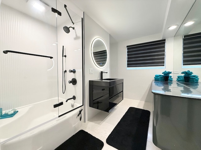 bathroom featuring vanity and combined bath / shower with glass door