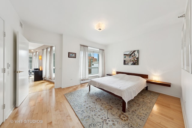 bedroom with light hardwood / wood-style flooring