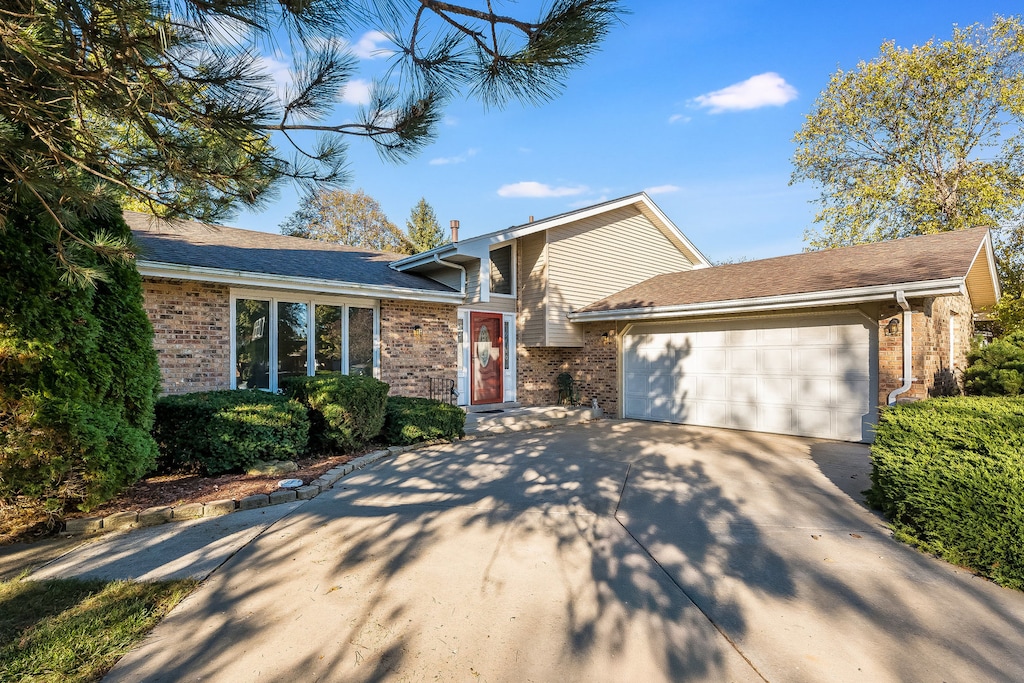 split level home featuring a garage