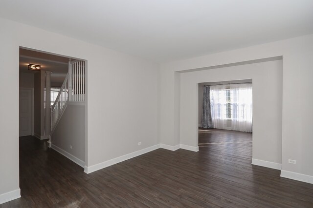 spare room featuring dark hardwood / wood-style floors