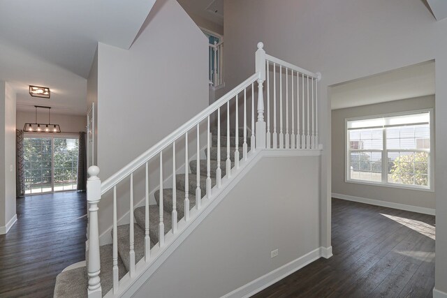 stairway featuring hardwood / wood-style floors