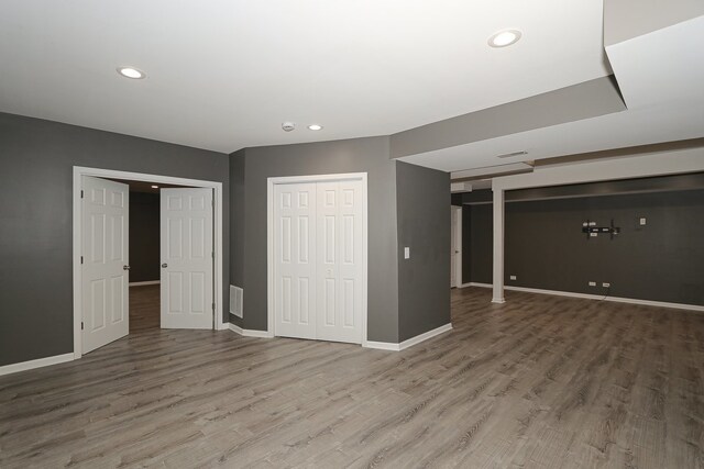 basement featuring hardwood / wood-style flooring