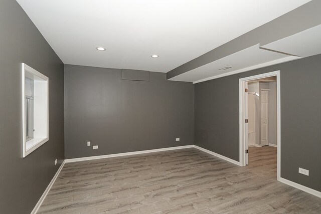 spare room featuring light hardwood / wood-style floors