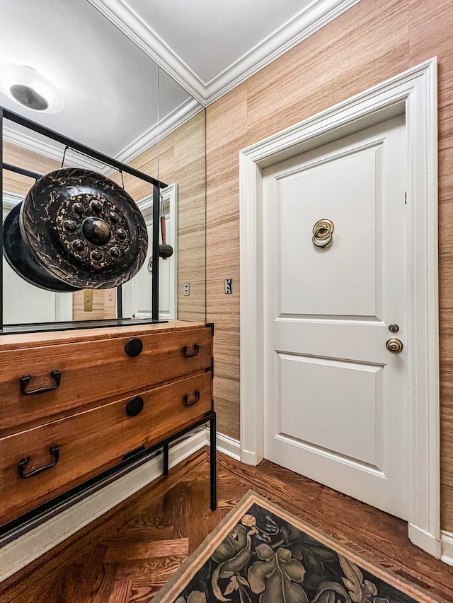 doorway featuring crown molding