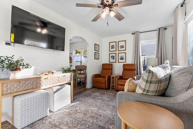 living room featuring hardwood / wood-style floors and ceiling fan